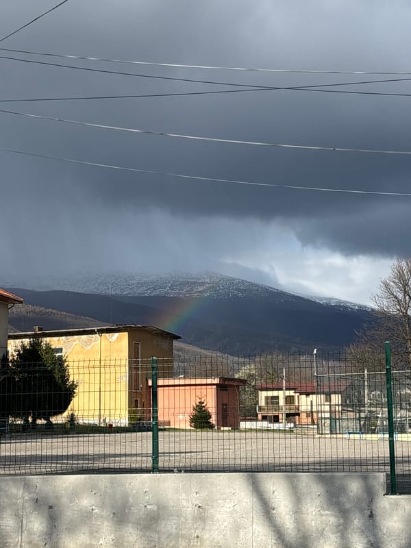 Rainbow appears over Zlatitsa, Bulgaria amid stormy skies