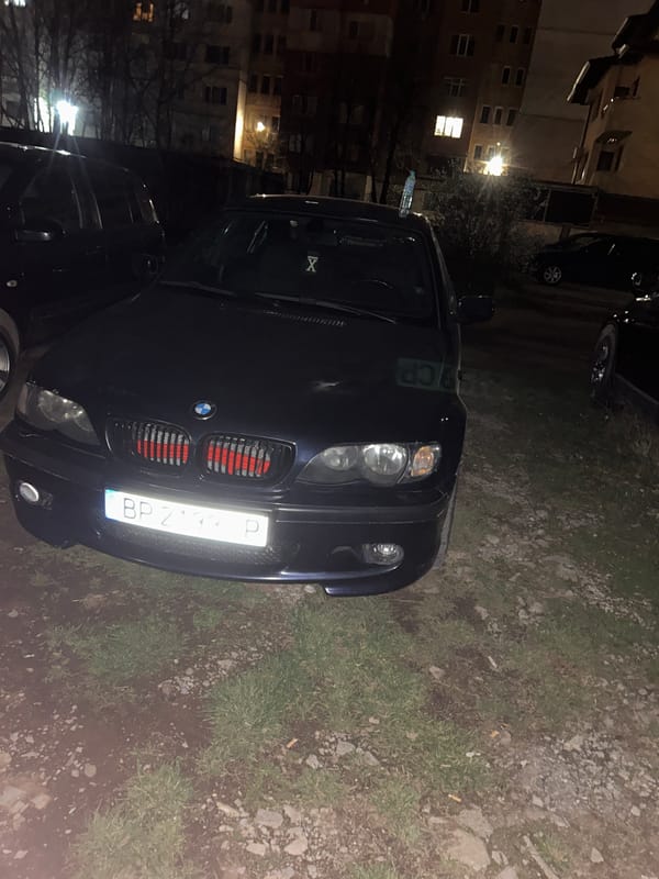 BMW parked on grass and gravel in Vratsa