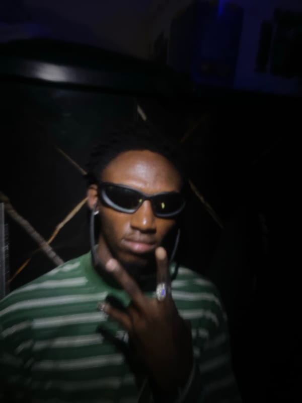 Person documents themselves with jewelry and gestures in Lokoja