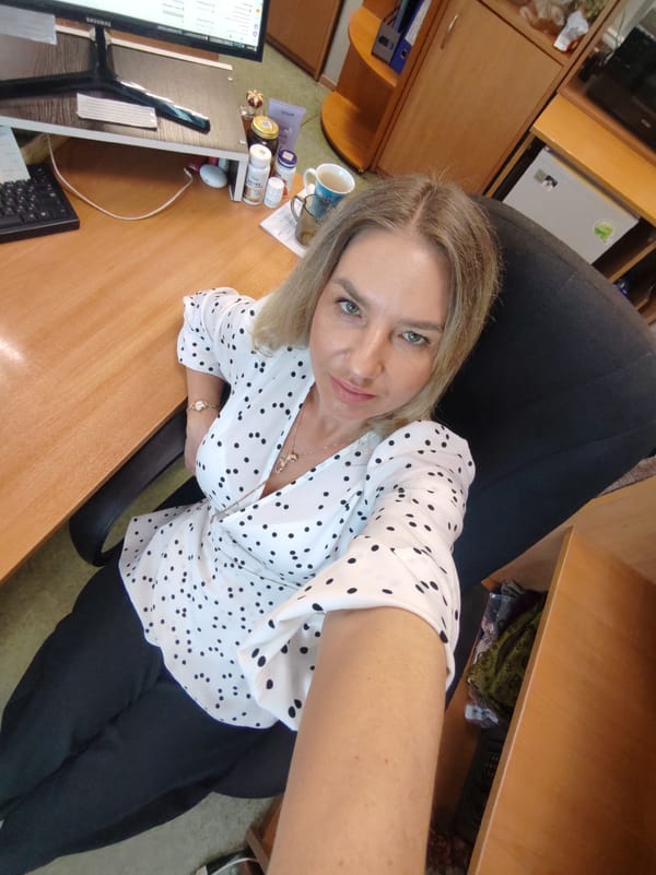 Woman takes office selfies in Petropavlovsk-Kamchatsky workspace