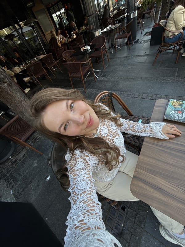 Woman takes selfies during cafe visit in Belgrade