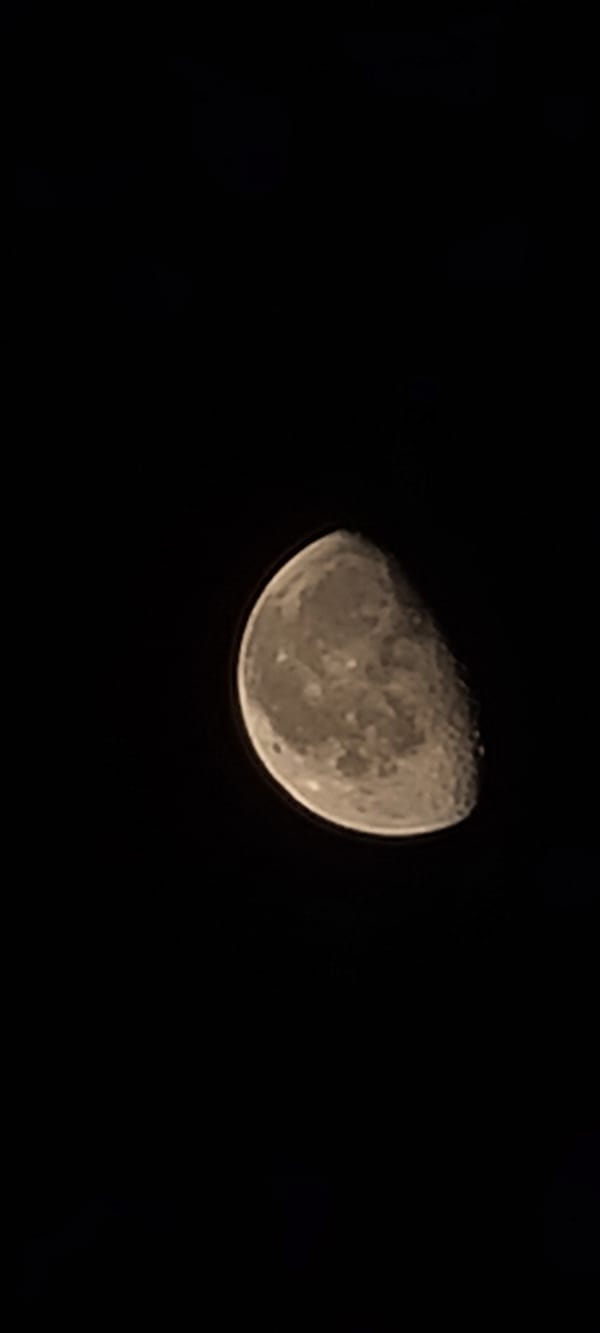 Waning gibbous moon photographed over Tashkent night sky