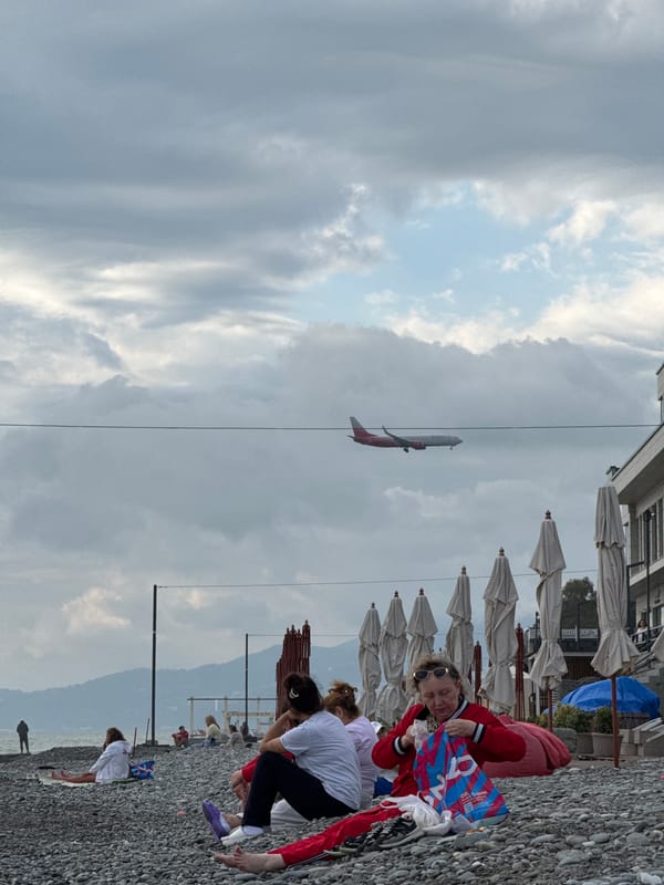 Families enjoy overcast afternoon at Sochi's pebble beach