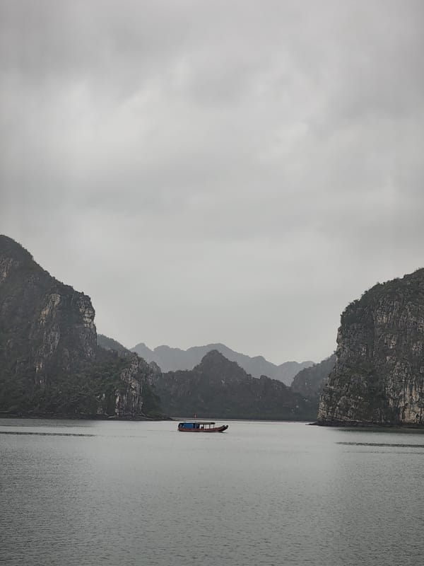 Woman observed on boat deck in Ha Long Bay