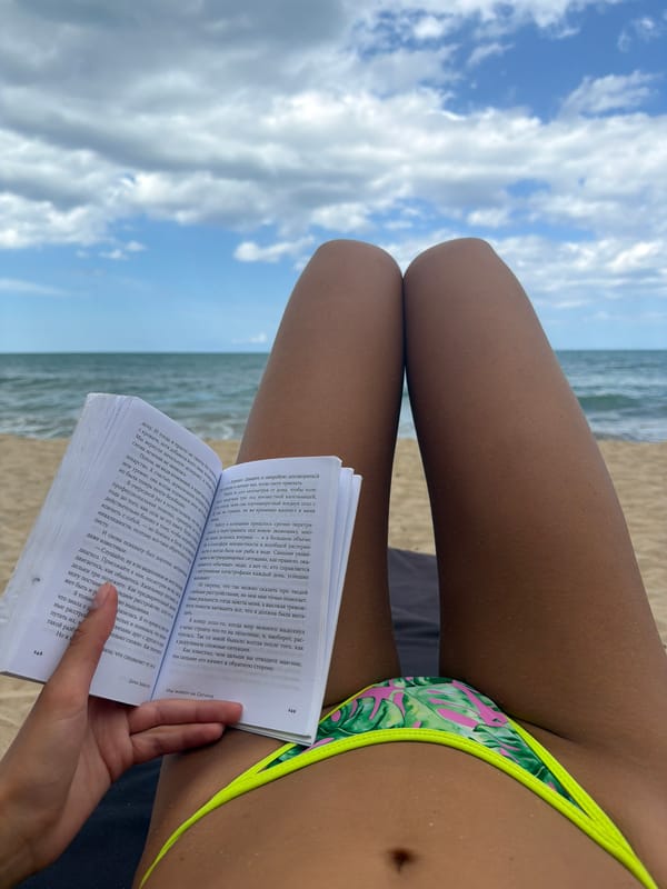 Beachgoer relaxes in sunny Arugam Bay, Sri Lanka
