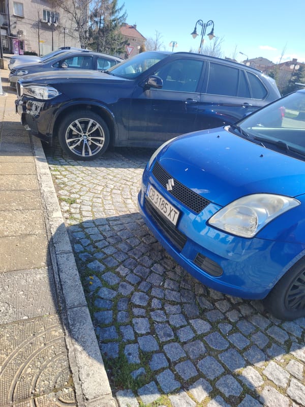 Blue Suzuki Swift spotted parked in Panagyurishte street scene