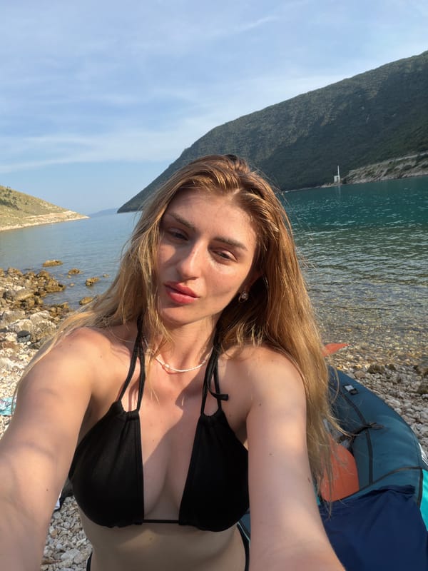 Selfies and kayak stop on a rocky coastal shoreline