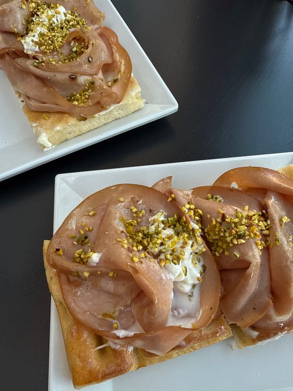 Open-faced sandwiches photographed on white plates in Milan