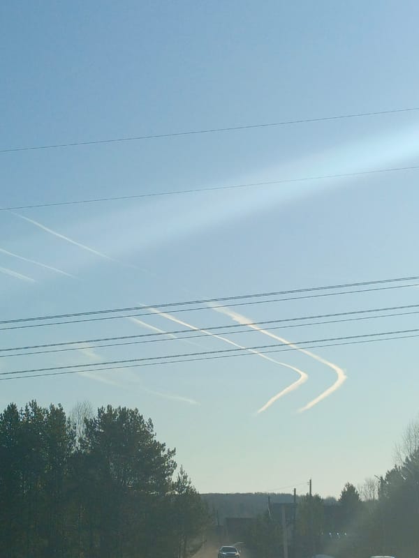Aircraft contrails form V-patterns over Dubovaya, Russia