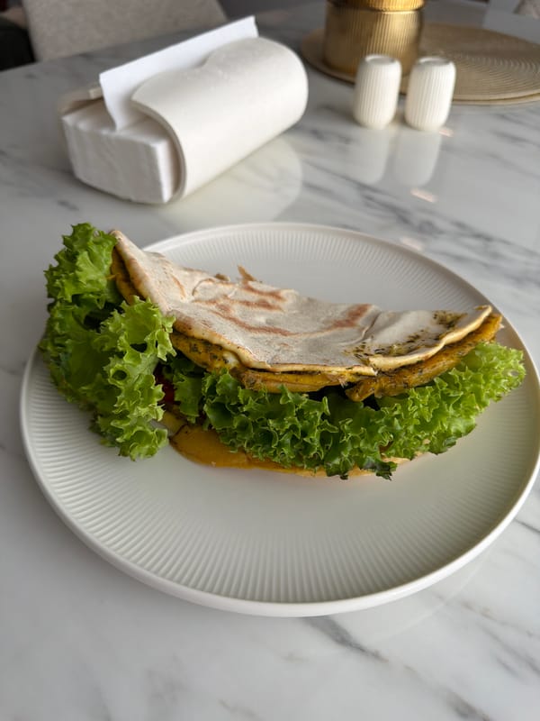 Breakfast meal documented at Chișinău café includes sandwich and dessert