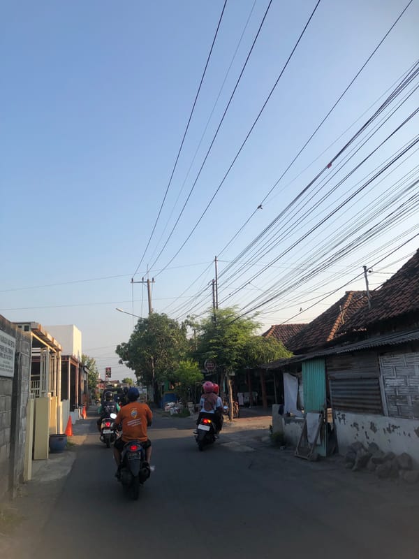 Morning street life across two Indonesian neighborhoods, July 2026