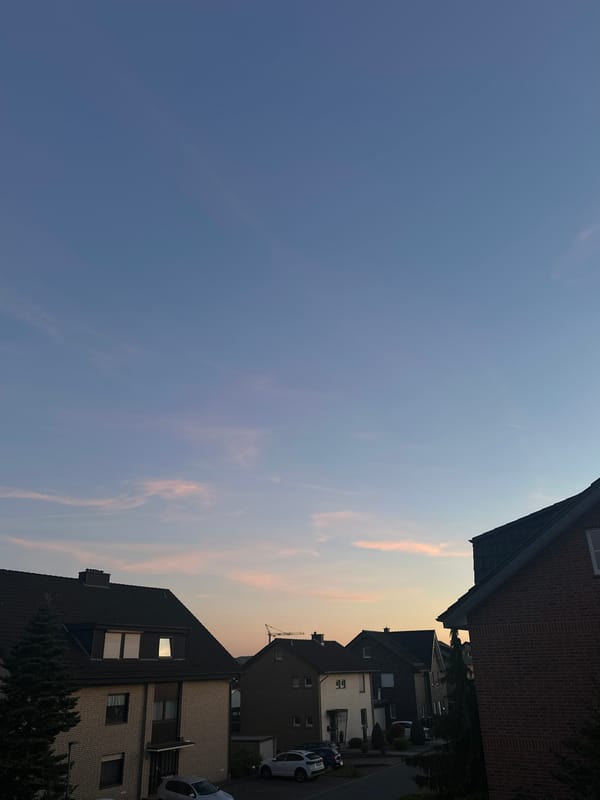 Dramatic sky captured over residential Melle street at sunset