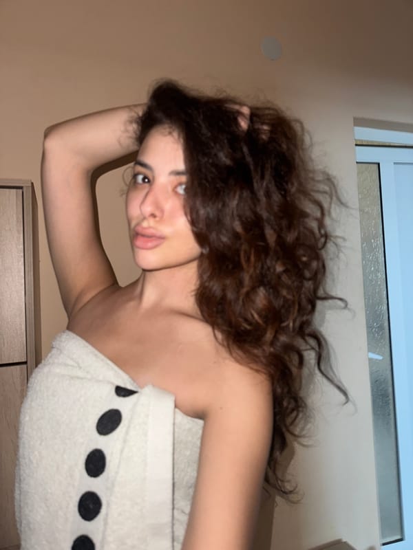 Post-shower selfie session at a Plovdiv home.