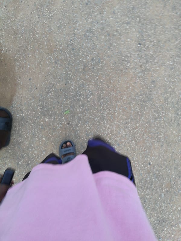 Person spotted on Lagos street amid mixed urban landscape