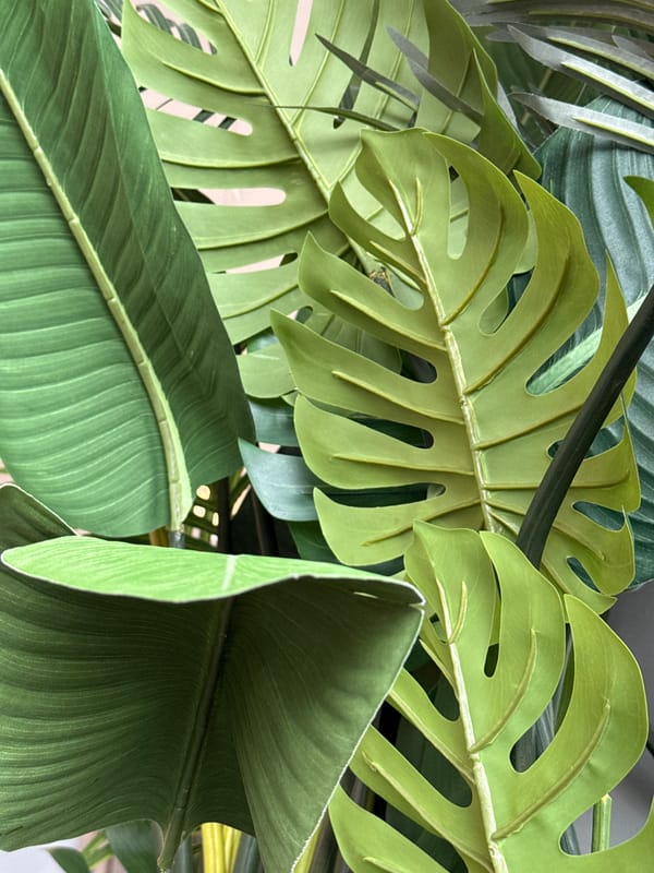 Toddler sits in blue container on wooden floor in Votkinsk