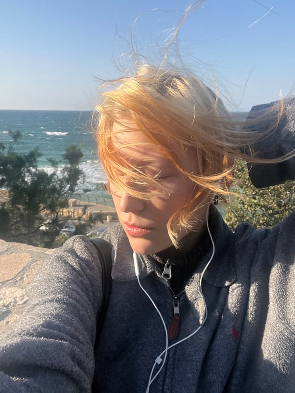 Tourist documents sunset walk through historic Old Jaffa district