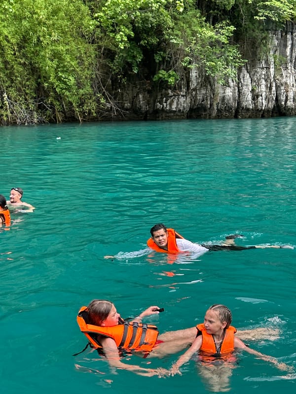 Early morning swimmers enjoy clear waters in Thailand