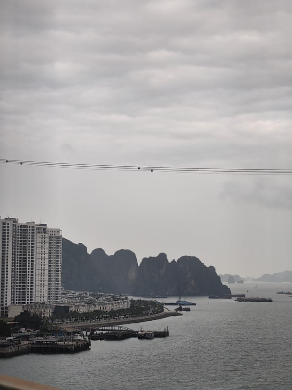 Overcast morning view captures Ha Long Bay coastal development