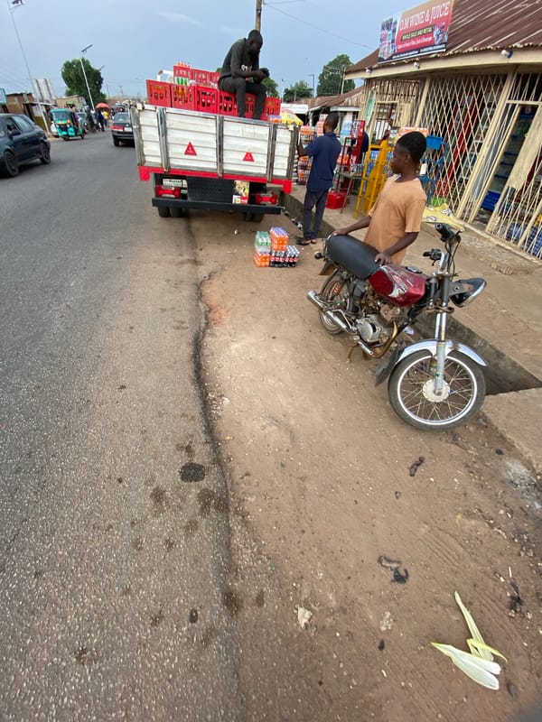 Roadside market activity documented in Jos, Nigeria commercial district