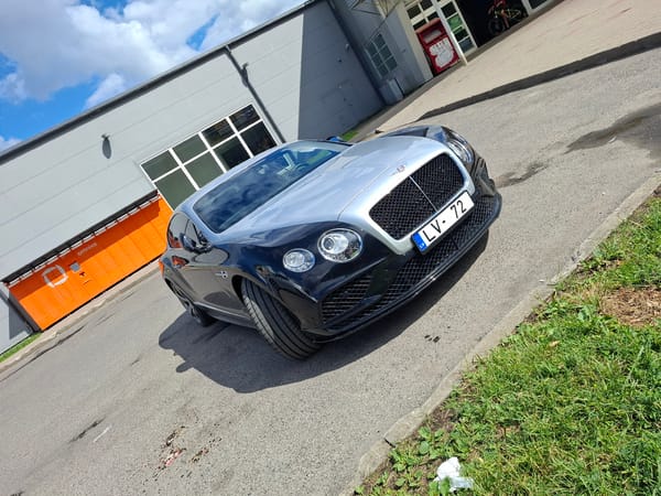 Bentley Continental GT parked outside Omniva branch in Riga