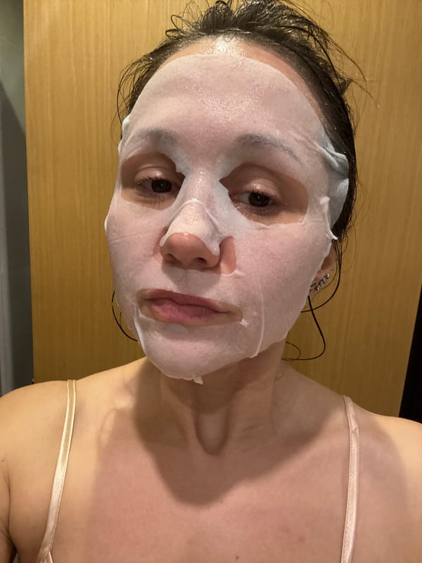Woman takes selfies while wearing facial mask in Dubai