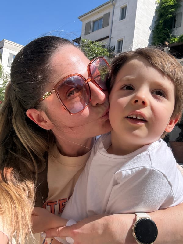 Adult and child share tender moment in Tivat