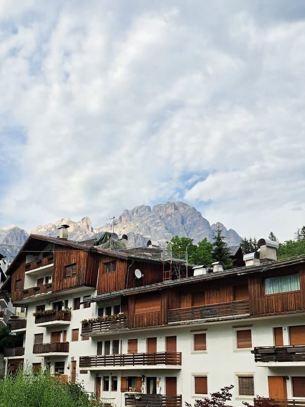 Alpine town and turquoise lake, midday exploration