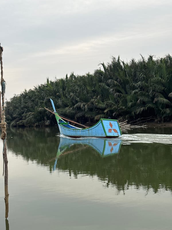 Fishing boat cruising coastal waters near Rhieng Blang, Indonesia