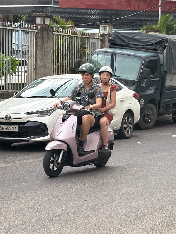 Scooter traffic on a Nha Trang street, July morning