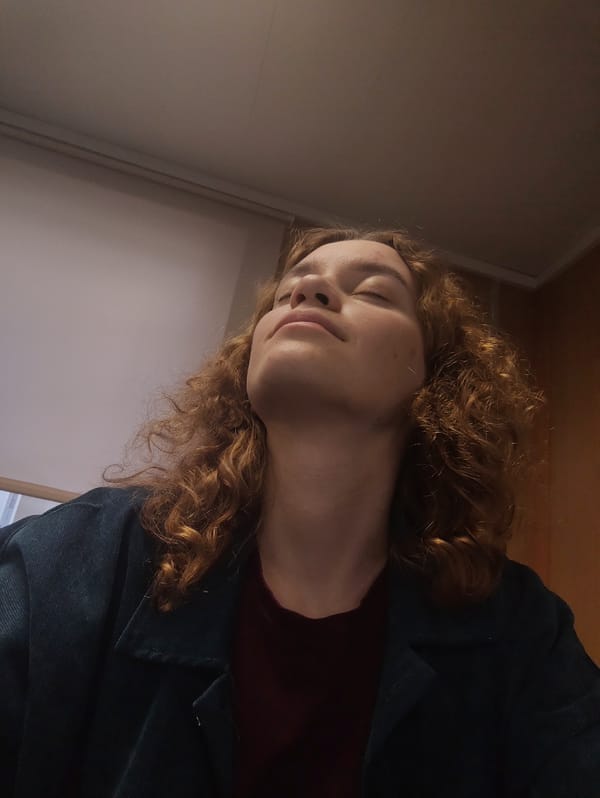 Woman gazing upward, empty bottle observed in indoor setting