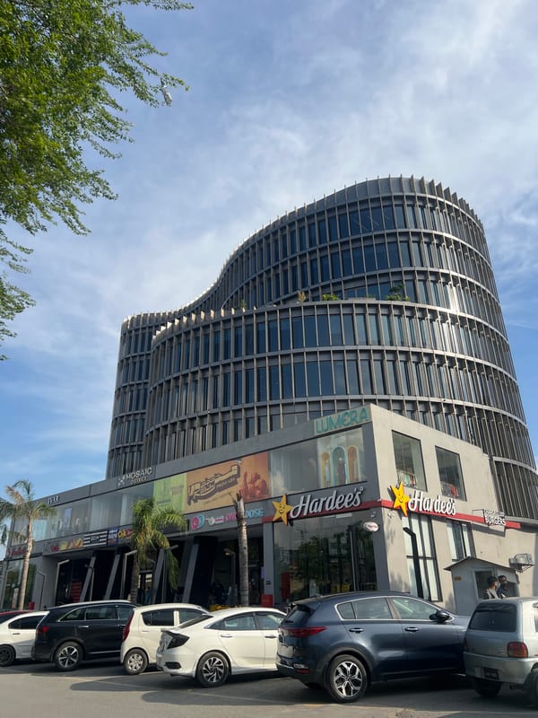 Modern curved building documented in Islamabad on sunny day