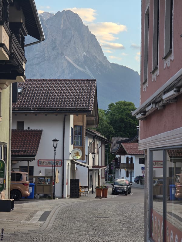 Golden hour in Garmisch-Partenkirchen, Alps looming over Bavarian streets