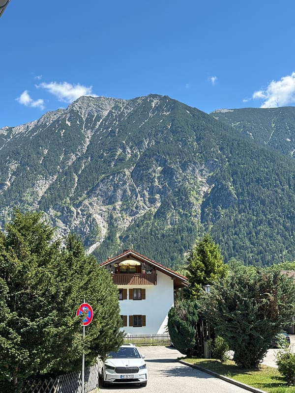 Roadside pause in Oberau with Alpine views behind