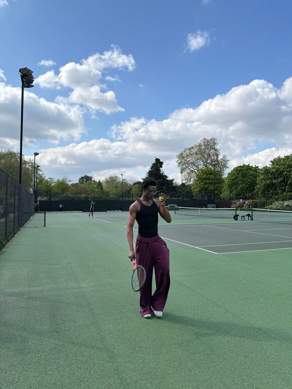 Tennis match in progress at London outdoor court