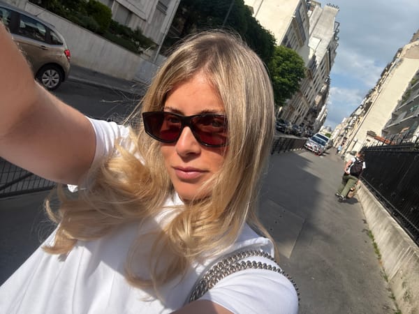 Blonde woman in sunglasses photographed multiple times in Paris
