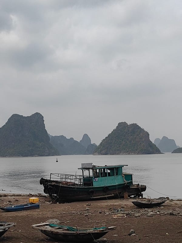 Overcast morning seascape captured in Hải Phòng with boats, karst islands