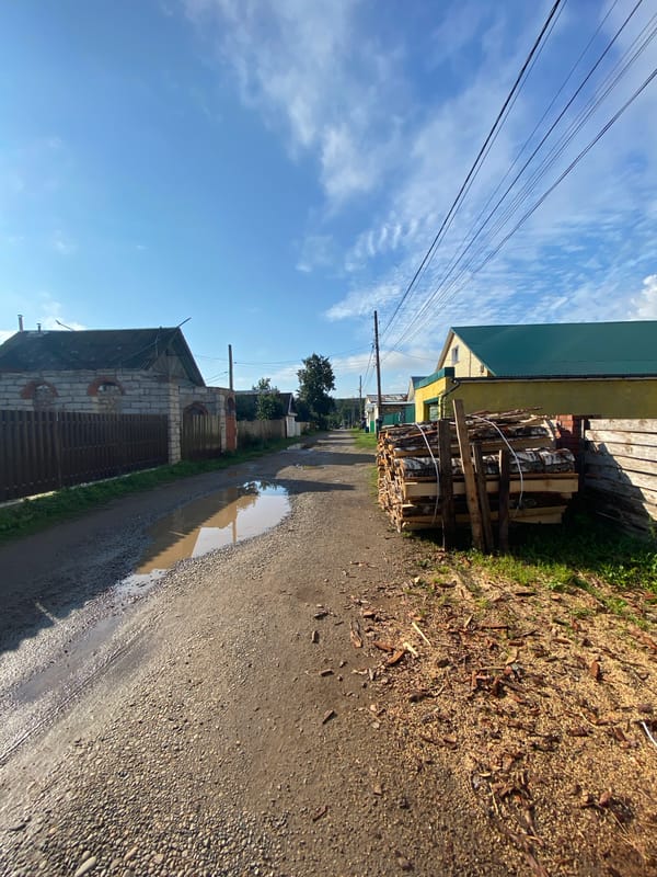 Rainy day stop on a muddy rural road in Chaikovsky