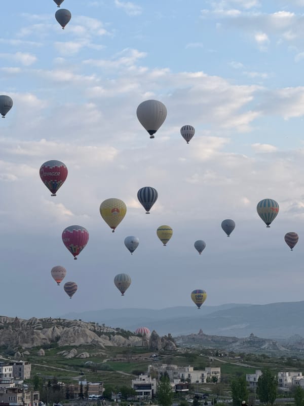Hot air balloons drift over Göreme's rock formations