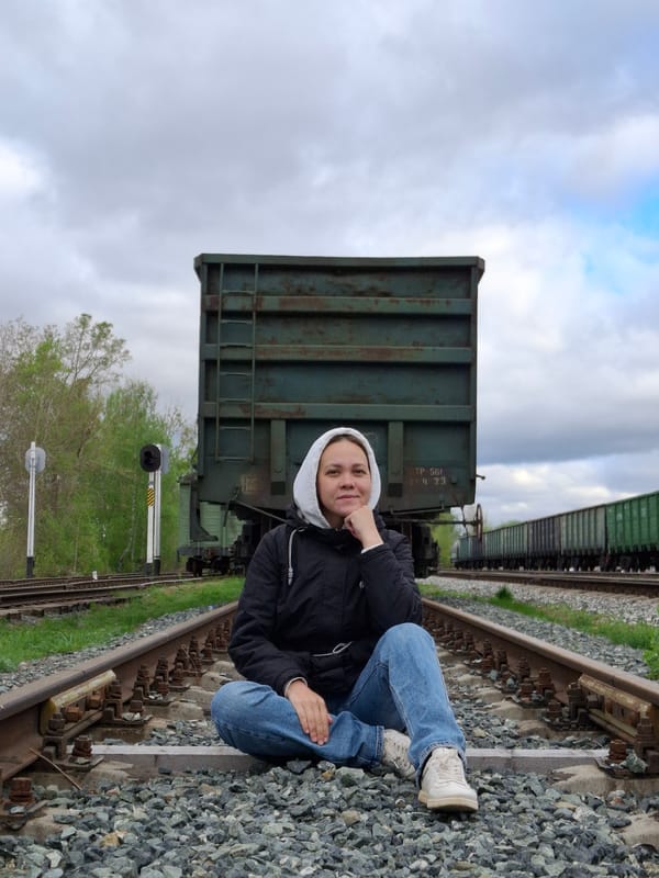 Person walks railroad tracks in Chaikovsky Russia early morning
