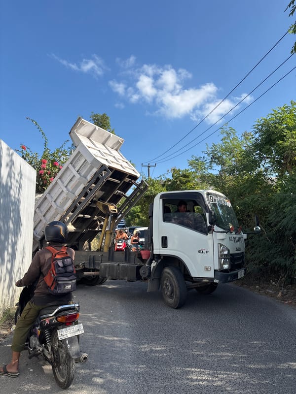 Dump truck blocks narrow road in Kuta Selatan, Bali