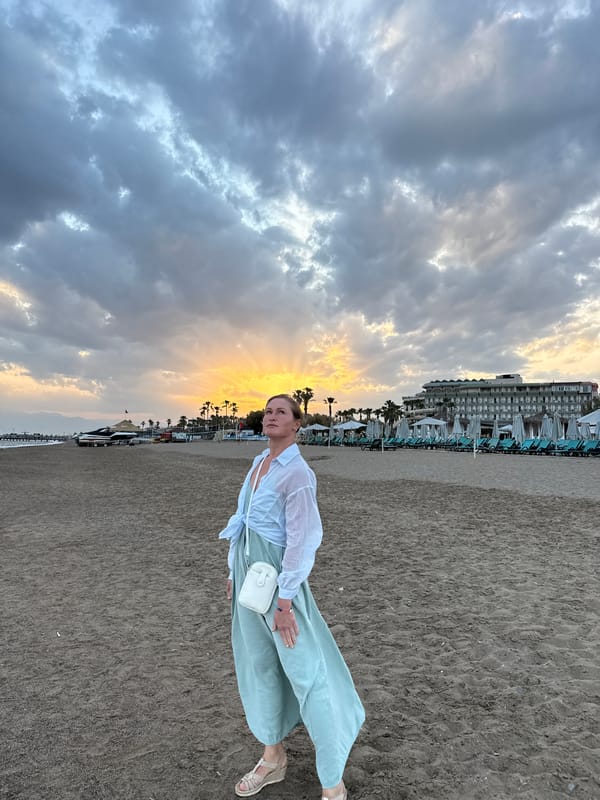 Woman poses for sunset photos on Serik beach