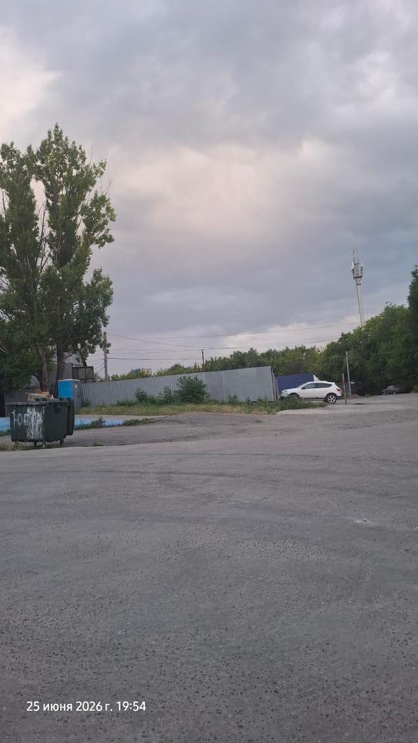 Parked car and cell tower along a Rostov-on-Don roadside