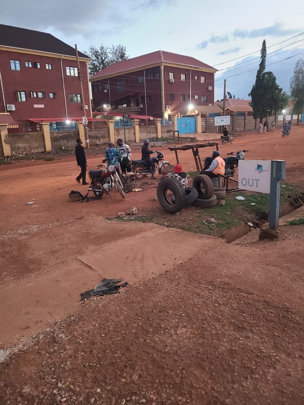 Everyday street life around a busy Abuja neighborhood