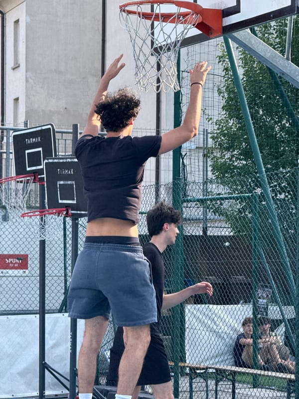 Outdoor basketball and foosball games documented in Milan