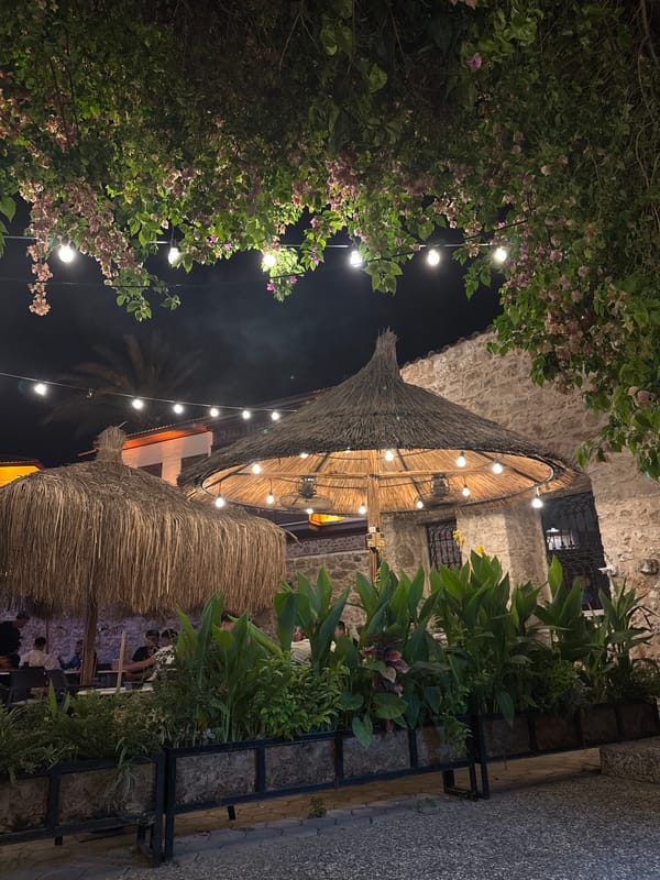 Antalya old city: nighttime dining spot and stone wall murals