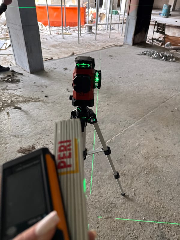 Construction site with laser surveying and elevator shaft documented