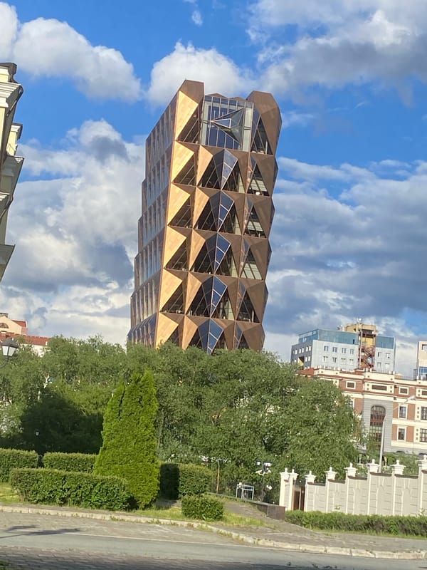 Tourist documents Yekaterinburg landmarks and parks during afternoon walk