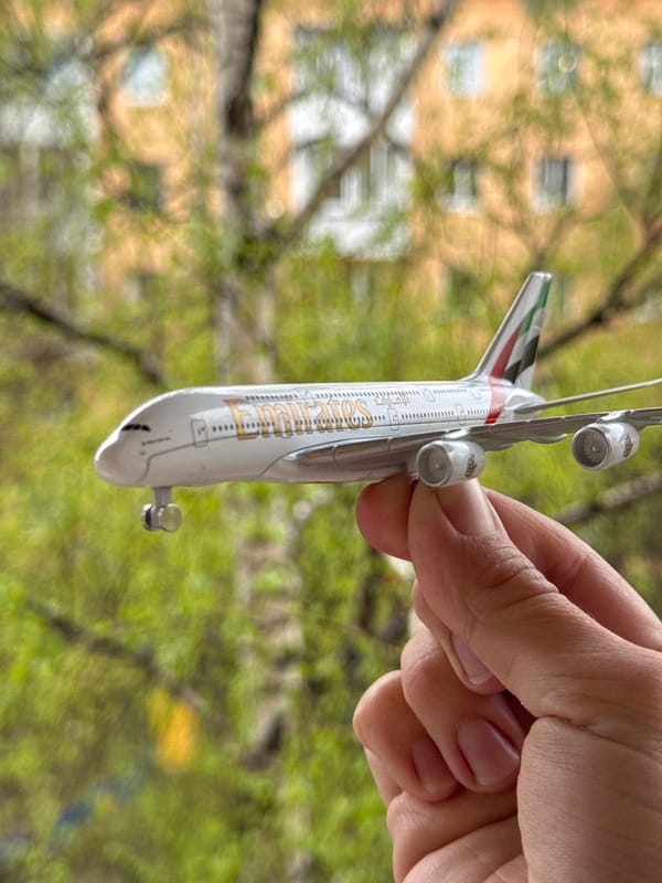 Toy Emirates airplane held in hand in Irkutsk
