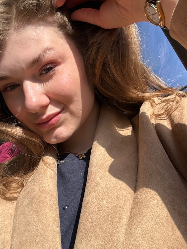 Woman takes selfie in Kazan wearing embellished blue outfit