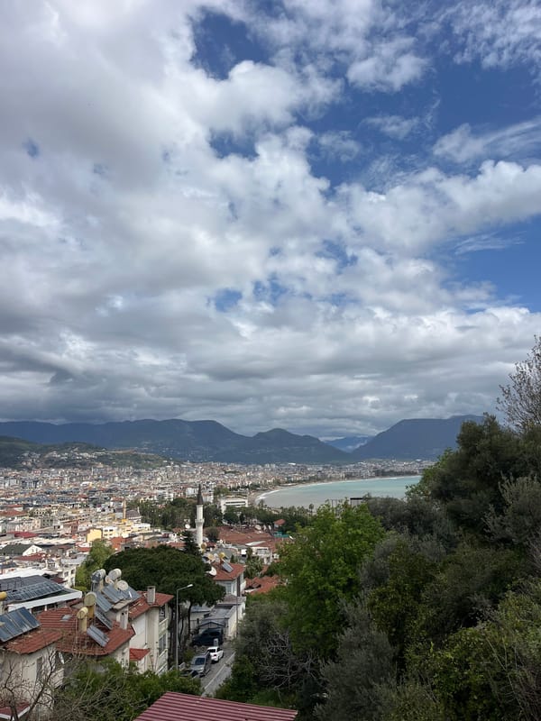 Tourist documents morning views of Alanya cityscape and buildings